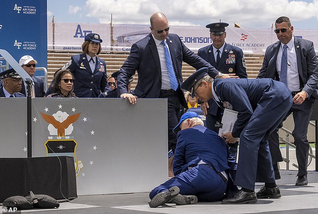 biden, 81, now has a secret service agent stand at the bottom of air force one steps to make sure he doesn't fall as his fitness for office comes under greater scrutiny