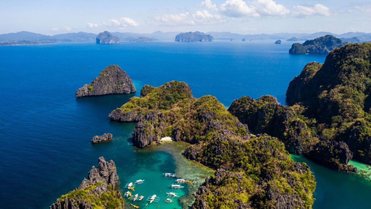 <p>El Nido in Palawan stands out as one of the most romantic destinations for couples in the Philippines. This paradise is renowned for its pristine white-sand beaches, vibrant turquoise waters, and stunning coral reefs, all set against magnificent limestone formations.</p><p>The charm of El Nido lies not just in its natural beauty but also in the wide array of activities that draw lovers to its shores. Snorkeling and scuba diving have long been favorites, allowing couples to explore the rich underwater world together. </p><p>Couples can embark on memorable island-hopping day trips from El Nido Town, exploring enchanting islands such as Simizu, Dilumacad, Cadlao, and Matinloc. These islands promise a day of adventure, from snorkeling in crystal-clear waters to discovering unique wildlife in the rainforest.</p><p>Beyond the beaches, the rainforest offers adventures around hidden waterfalls and opportunities for romantic treks. Couples can delve into the untouched beauty of nature, encountering exotic birds and rare plant species. </p>