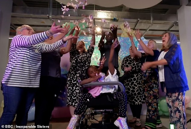 touching moment conjoined twins marieme and ndeye are given their own coats at inclusive design facility after their dad struggled to find them clothes - as seven-year-olds who were given days to live defy the odds