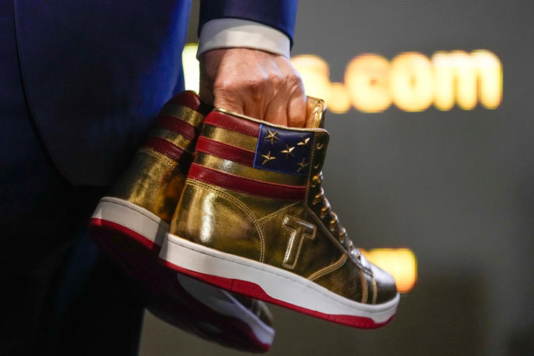 Trump unveils 399 gold hightop sneakers after being ordered to pay