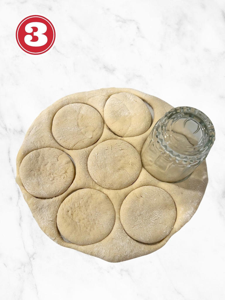 cutting doughnut rings with a glass