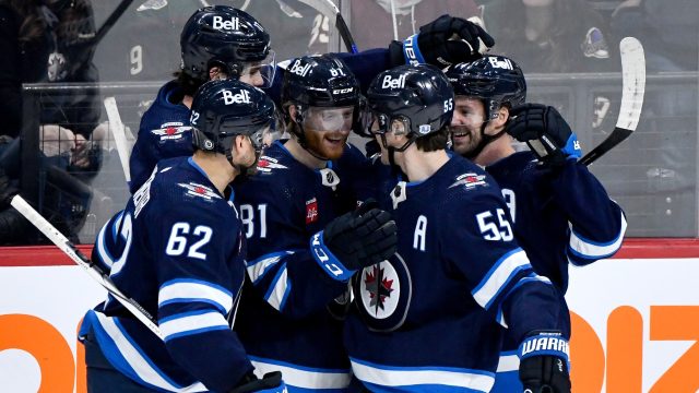 jets hold on to beat avalanche in wild series opener