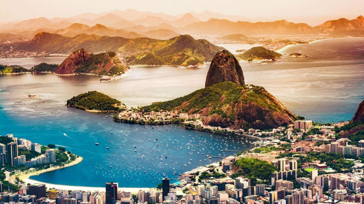 <p>Rio’s skyline is dramatically set against the natural wonders of Sugarloaf Mountain and Christ the Redeemer. </p><p>The city’s geography, with its stunning beaches and lush mountains, plays a significant role in its breathtaking skyline. It’s a vivid example of how nature and urban life can coexist in harmony.</p>