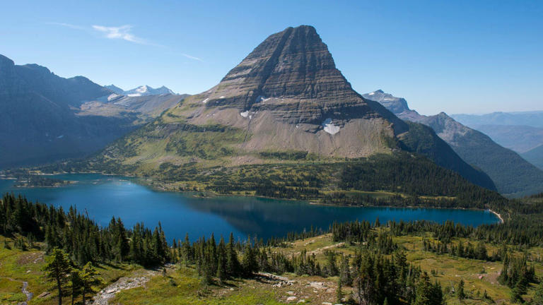 Glacier National Park is surrounded by chiseled valleys and peaks in the Rocky Mountains of Montana. Wolfgang Kaehler/LightRocket via Getty Images