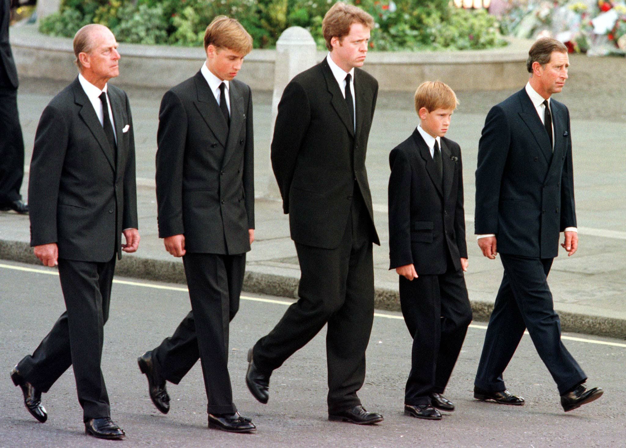 <p>On Sept. 6, 1997, a funeral for Princess Diana, whose <a href="https://www.wonderwall.com/celebrity/royals/biggest-royals-news-of-august-2021-490239.gallery?photoId=490257">divorce </a>from Prince Charles (now King Charles III) had been finalized one year earlier, was held in London six days after she died in Paris following a tragic car crash. </p><p>Five of Princes Diana's male family members -- former father-in-law Prince Philip, son Prince William, brother Charles Spencer, 9th Earl Spencer, son Prince Harry and ex-husband Prince Charles (now King Charles III) -- followed her coffin past hundreds of thousands of mourners during her funeral procession to London's Westminster Abbey in London on Sept. 6, 1997.</p><p>Keep reading for <span>more photos from Diana's heartbreaking goodbye...</span></p>