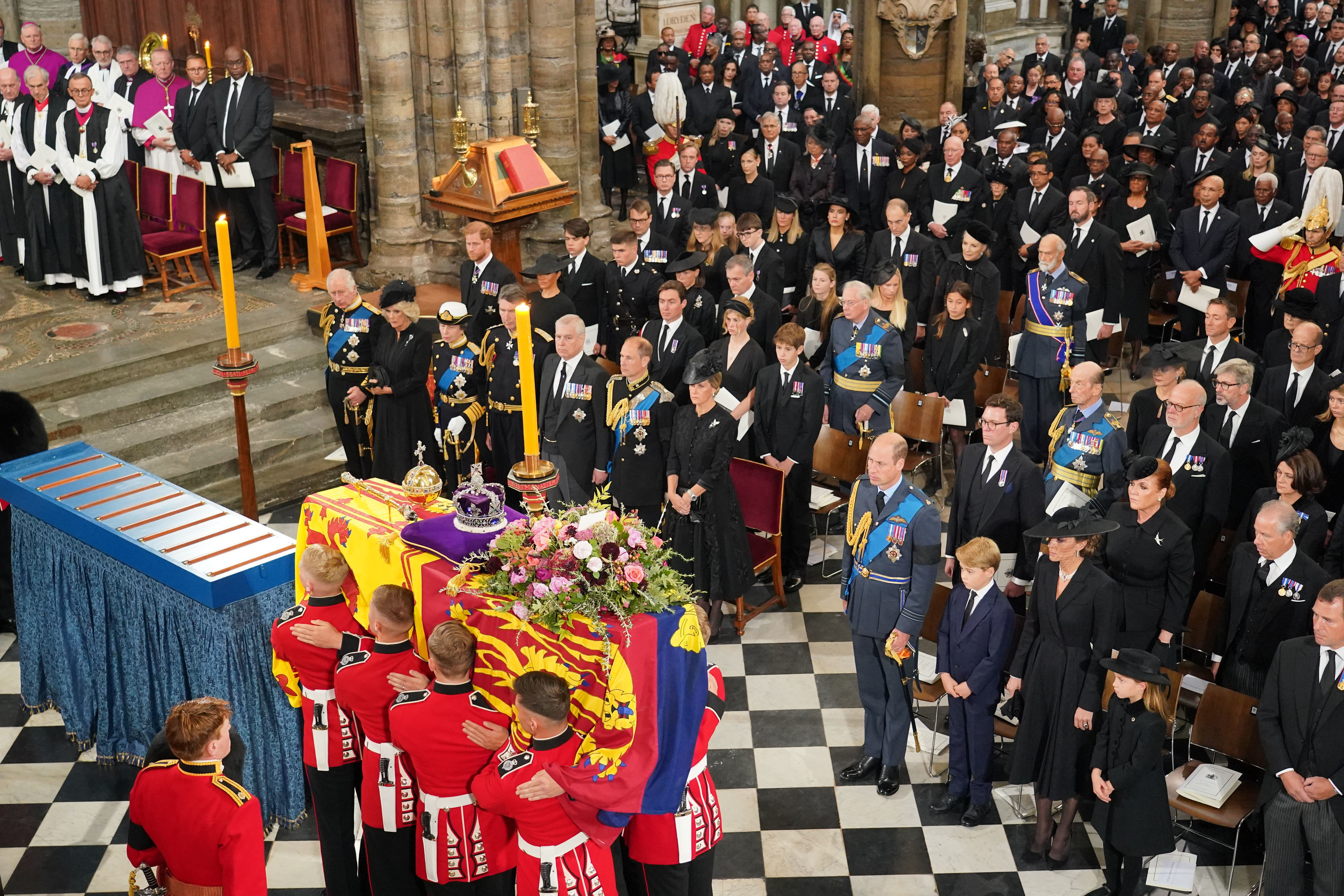 <p>The coffin of Queen Elizabeth II, draped in the Royal Standard with the Imperial State Crown and the Sovereign's Orb and Sceptre, was carried by a military bearer party inside Westminster Cathedral in London on Sept. 19, 2022, as the royal family looked on during <a href="https://www.wonderwall.com/celebrity/royals/best-photos-from-queen-elizabeth-ii-funeral-king-charles-princes-william-prince-harry-george-charlotte-kate-meghan652347.gallery">her state funeral</a>: (front row) King Charles III, Camilla, Queen Consort, Princess Anne, Vice Admiral Sir Tim Laurence, Prince Andrew Prince Edward, Sophie, Countess of Wessex, Prince William, Prince George, Princess Kate, Princess Charlotte and Peter Phillips; (second row) Prince Harry, Duchess Meghan, Princess Beatrice, Edoardo Mapelli Mozzi and Lady Louise Windsor, James, Viscount Severn, Jack Brooksbank, Princess Eugenie, Sarah, Duchess of York, David Armstrong-Jones, the Earl of Snowdon; (third row) Samuel Chatto, Arthur Chatto, Lady Sarah Chatto, Daniel Chatto, the Duke of Gloucester, the Duke of Kent, the Earl and Countess of St. Andrews. </p>