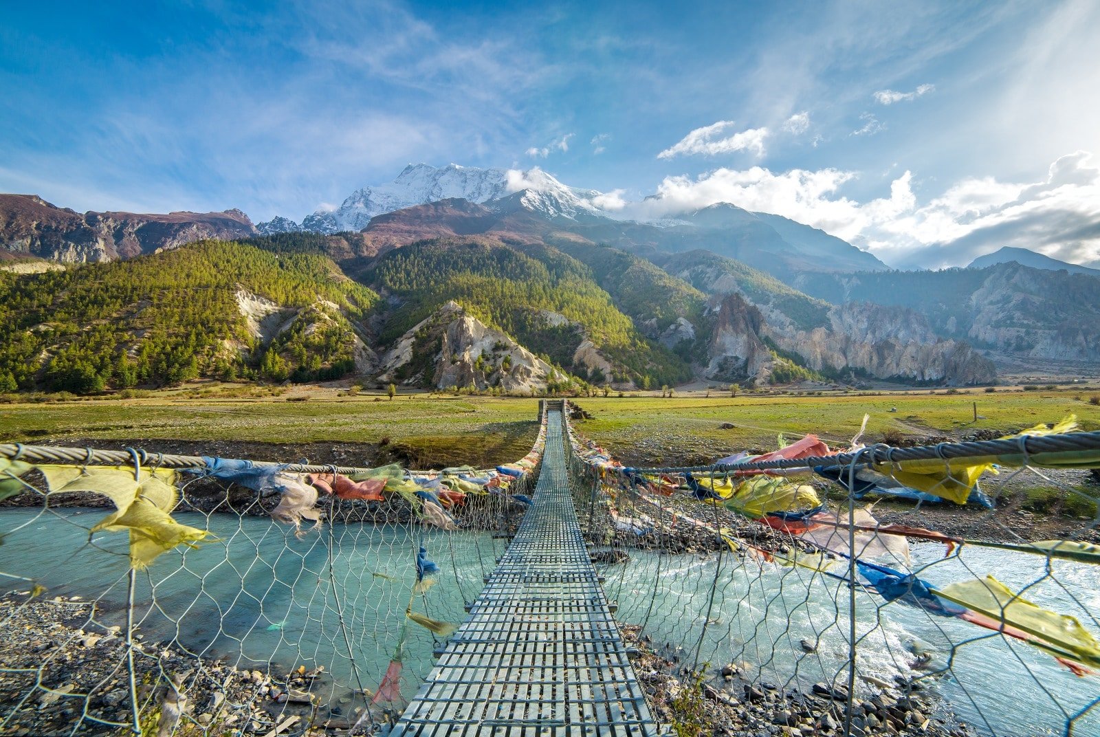 <p><span>Discover Nepal’s diverse landscapes and rich cultural history on the Annapurna Circuit. This trek has captivated adventurers for decades. Spanning approximately 100 to 145 miles, the journey varies based on chosen routes and side excursions. As you traverse this trail, you’ll experience a dramatic shift in scenery, from lush rice paddies and subtropical forests to arid high-altitude plateaus.</span></p> <p><span>The trek is a window into the soul of Nepal, offering glimpses of rural life in remote villages and the opportunity to interact with the warm and hospitable Gurung and Thakali communities. The trek’s high point, literally and figuratively, is crossing the Thorong La Pass at 17,769 feet, a challenging yet exhilarating endeavor.</span></p> <p><span>Each step on this trail brings you closer to the towering Himalayas and deeper into a land rich in history and tradition. The Annapurna Circuit is not just a trek; it explores the human spirit amidst some of the most awe-inspiring landscapes on earth.</span></p> <p><b>Insider’s Tip: </b><span>Acclimatize properly to avoid altitude sickness.</span></p> <p><b>When To Travel: </b><span>September to November and March to May offer the best weather.</span></p> <p><b>How To Get There: </b><span>The trek usually starts in Besisahar or Bhulbhule, which is accessible by bus from Kathmandu or Pokhara.</span></p>