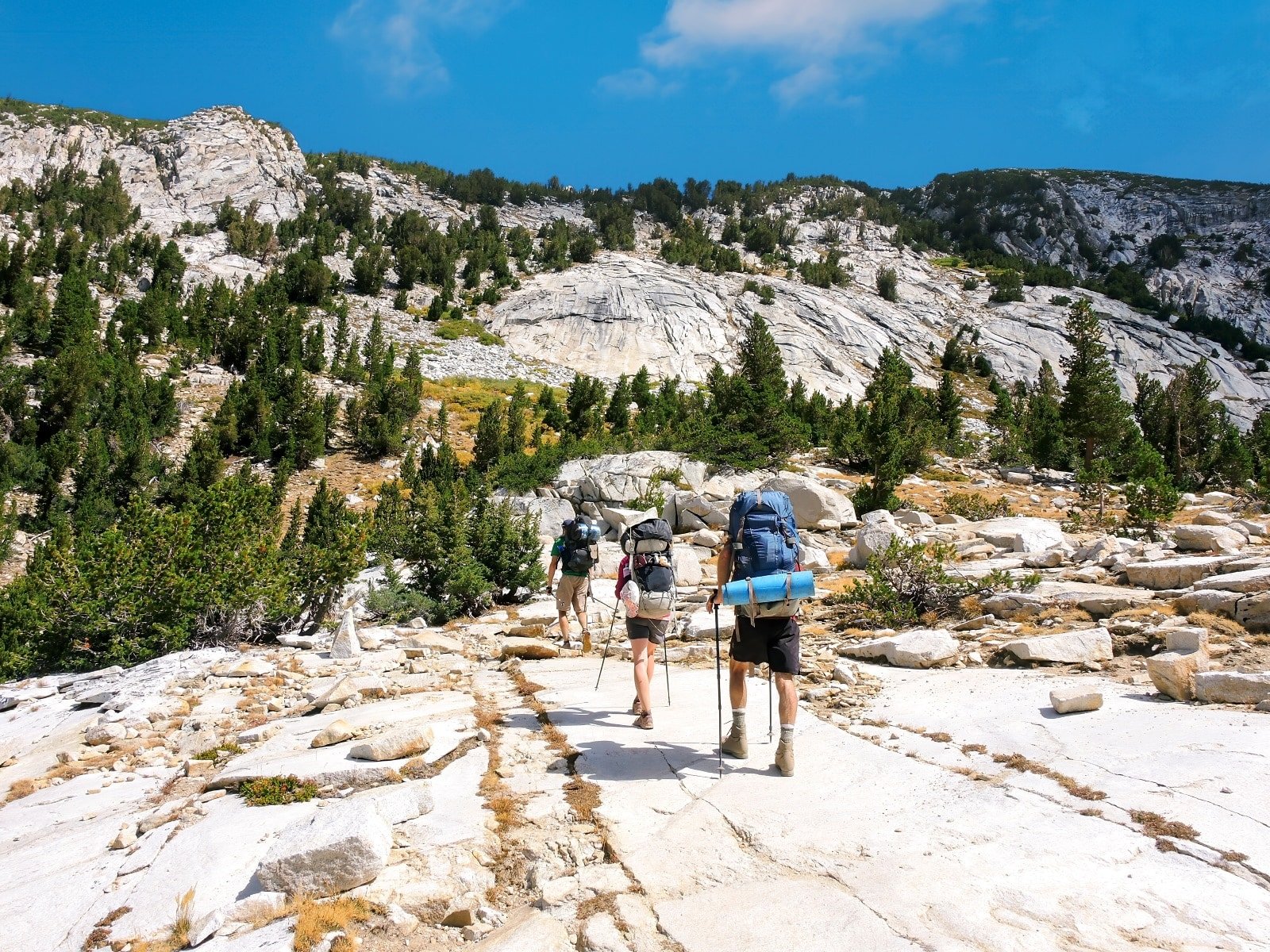 <p><span>Embark on an epic journey through the heart of California’s Sierra Nevada mountain range on the John Muir Trail. This path encapsulates the raw beauty of the American wilderness. Spanning 211 miles from Yosemite Valley to Mount Whitney, this trail offers some of the most breathtaking scenery in the United States.</span></p> <p><span>As you trek through this diverse landscape, you’ll encounter majestic waterfalls, serene alpine lakes, and some of the tallest peaks in the contiguous United States. The trail, named in honor of the renowned naturalist John Muir, highlights the beauty he worked to preserve. It winds through iconic wilderness areas, including Yosemite, Kings Canyon, and Sequoia National Parks, each offering its own unique beauty and challenges.</span></p> <p><span>The journey typically takes about three weeks, traversing through deep canyons, high mountain passes, and lush meadows. Along the way, you’ll likely encounter diverse wildlife, from mule deer to black bears, adding to the sense of adventure and connection with nature. The John Muir Trail is not just a hike; it’s a pilgrimage through some of the most stunning landscapes in North America, a journey that offers solitude, beauty, and a profound sense of accomplishment.</span></p> <p><b>Insider’s Tip: </b><span>Secure permits early, as they are in high demand during summer.</span></p> <p><b>When To Travel: </b><span>July to September is the most favorable period.</span></p> <p><b>How To Get There: </b><span>The trailhead is in Yosemite National Park, accessible from major cities in California.</span></p>