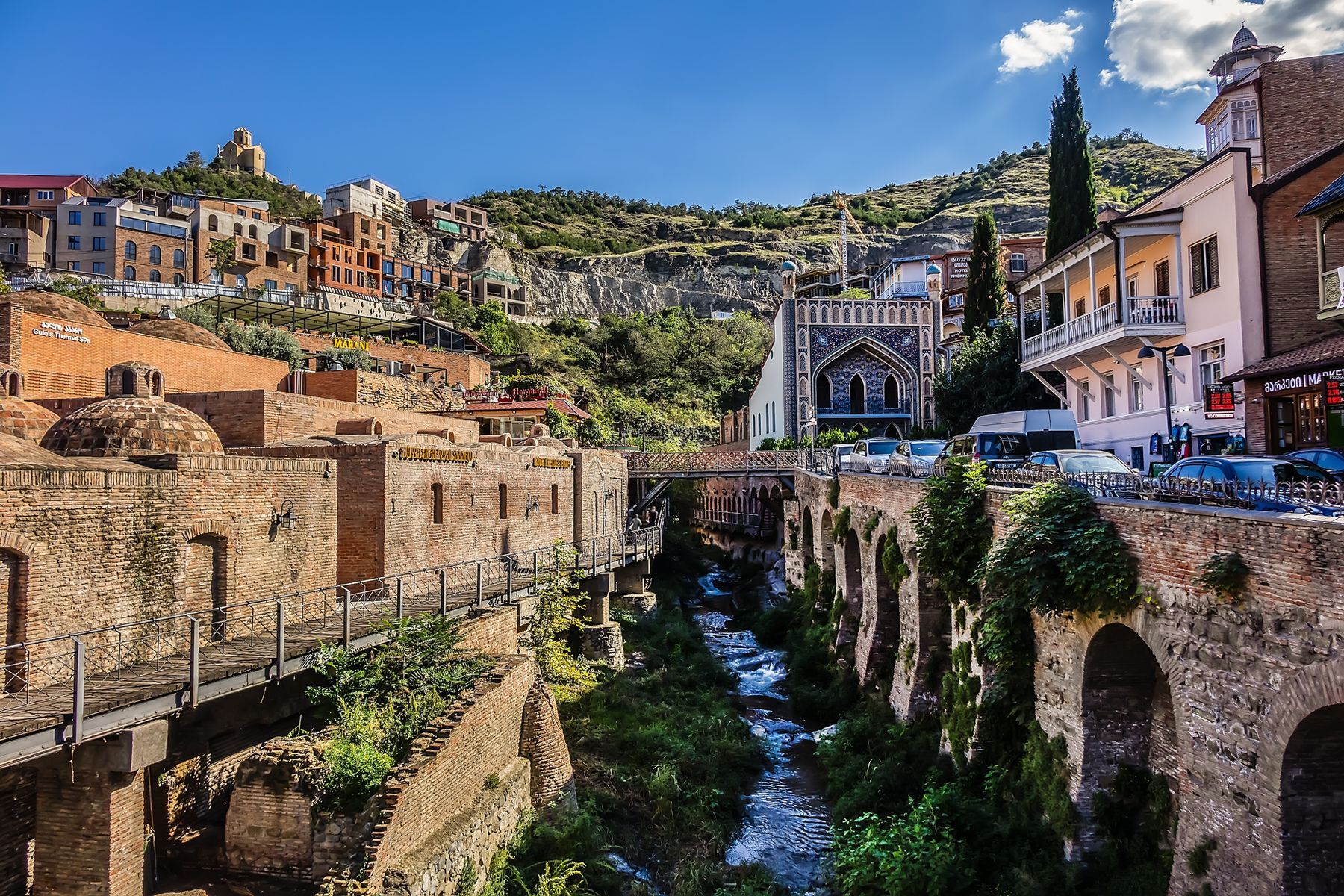 <p>With a cost of living that’s <a href="https://www.numbeo.com/cost-of-living/in/Tbilisi" rel="noreferrer noopener">57% lower than that of France</a>, Georgia is the perfect destination for spendthrift travellers. Indeed, the capital’s <a href="https://tbilisilocalguide.com/public-transport-in-tbilisi/" rel="noreferrer noopener">varied</a> <a href="https://tbilisilocalguide.com/public-transport-in-tbilisi/" rel="noreferrer noopener">and</a> <a href="https://tbilisilocalguide.com/public-transport-in-tbilisi/" rel="noreferrer noopener">inexpensive</a> <a href="https://tbilisilocalguide.com/public-transport-in-tbilisi/" rel="noreferrer noopener">public</a> <a href="https://tbilisilocalguide.com/public-transport-in-tbilisi/" rel="noreferrer noopener">transit</a> <a href="https://tbilisilocalguide.com/public-transport-in-tbilisi/" rel="noreferrer noopener">system</a> makes moving around the city easy. Built around several hot springs, Tbilisi has also developed a reputation for its <a href="https://tbilisilocalguide.com/tbilisi/sulfur-baths/" rel="noreferrer noopener">public sulphur baths</a>. Reserve an individual room, if finances allow, and enjoy a relaxing moment before setting out for Old Tbilisi, a historical district located in the heart of the city. Once there, you’ll find the ruins of <a href="https://wander-lush.org/narikala-fortress-tbilisi-georgia/" rel="noreferrer noopener">Narikala Fortress</a>, a 4th-century citadel. For affordable Georgian cuisine, check out <a href="https://www.facebook.com/ChemoKargoNadzaladevi/" rel="noreferrer noopener">Chemo</a> <a href="https://www.facebook.com/ChemoKargoNadzaladevi/" rel="noreferrer noopener">Kargo</a> at one of the restaurant’s two locations.</p>