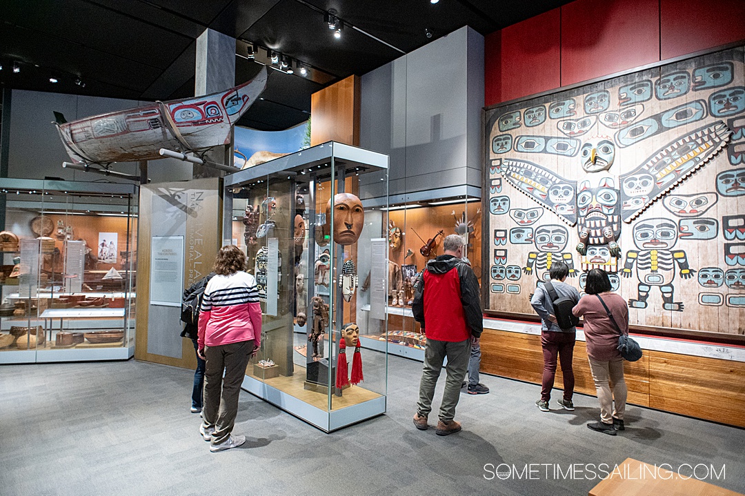 Interior of Alaska State Museum in Juneau, with indigenous artifacts and art.