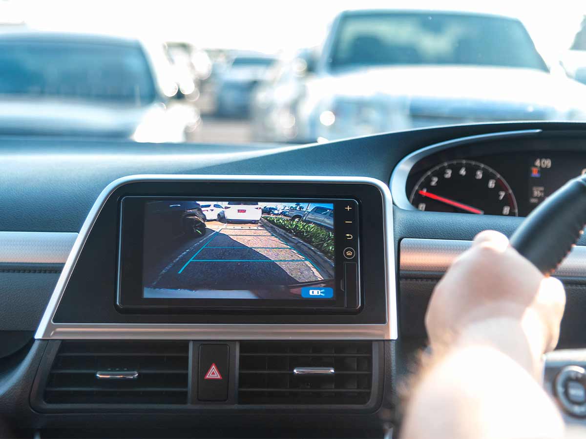 <p>Using a rear-pointed camera, this feature is activated when the car is placed in reverse. Meant to aid in backing into or out of a parking space, this feature also helps detect pedestrians.</p> <p>The backup camera was another feature that was previously just optional, but now it's a gold standard for new automobiles.</p>