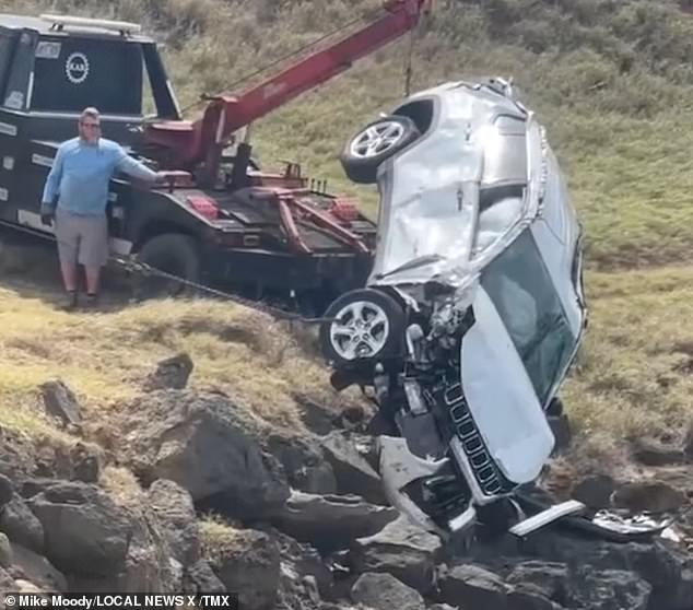 tourist, 27, accidentally drives his jeep off a 60ft cliff after taking a wrong turn while off-roading in hawaii - but somehow survives despite falling from wreckage and being swept out to sea
