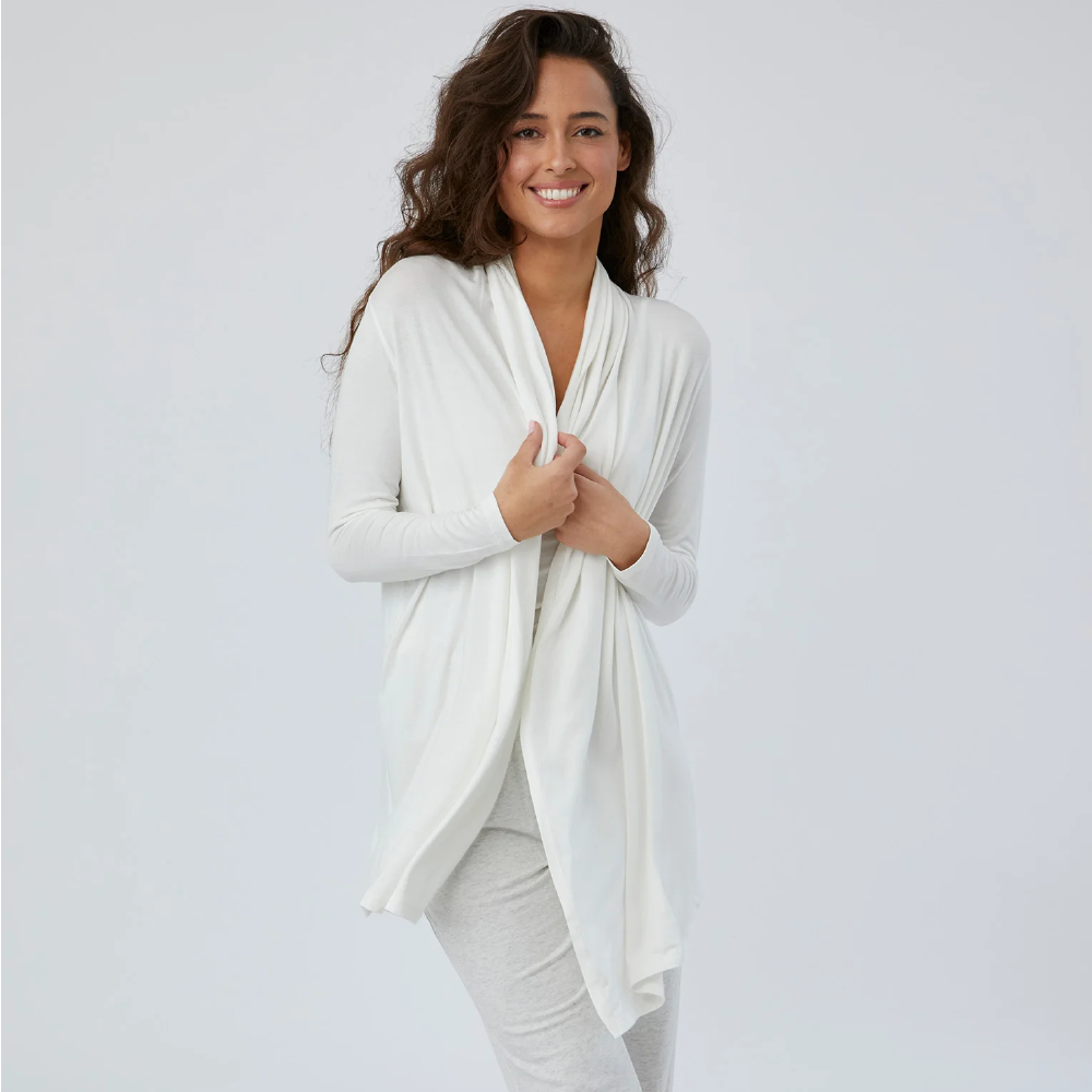 <p><strong>$148.00</strong></p><p><a href="https://www.thewheatcollection.com/collections/womens/products/atlanta-wrap">Shop Now</a></p><p>Wheat is my newest obsession. It has the softest, most comfortable, luxe loungewear I have ever tested, and I want everyone around me to get on board. This lil wrap with sleeves is the perfect addition to my travel outfits and everyday wear. If I need a layer for extra warmth or to go over a T-shirt or tank, this bb is my go-to. I bring it with me on all trips because I know I'll find a use for it on the airplane and throughout my travels. If you want something a lil thicker, or have a v long flight, try Wheat's <a href="https://www.thewheatcollection.com/collections/womens/products/aspen-wrap?variant=42889184805101">Aspen Wrap</a>.</p><ul><li><strong>Material: </strong>Micromodal</li><li><strong>Colors: </strong>Black, white</li></ul>