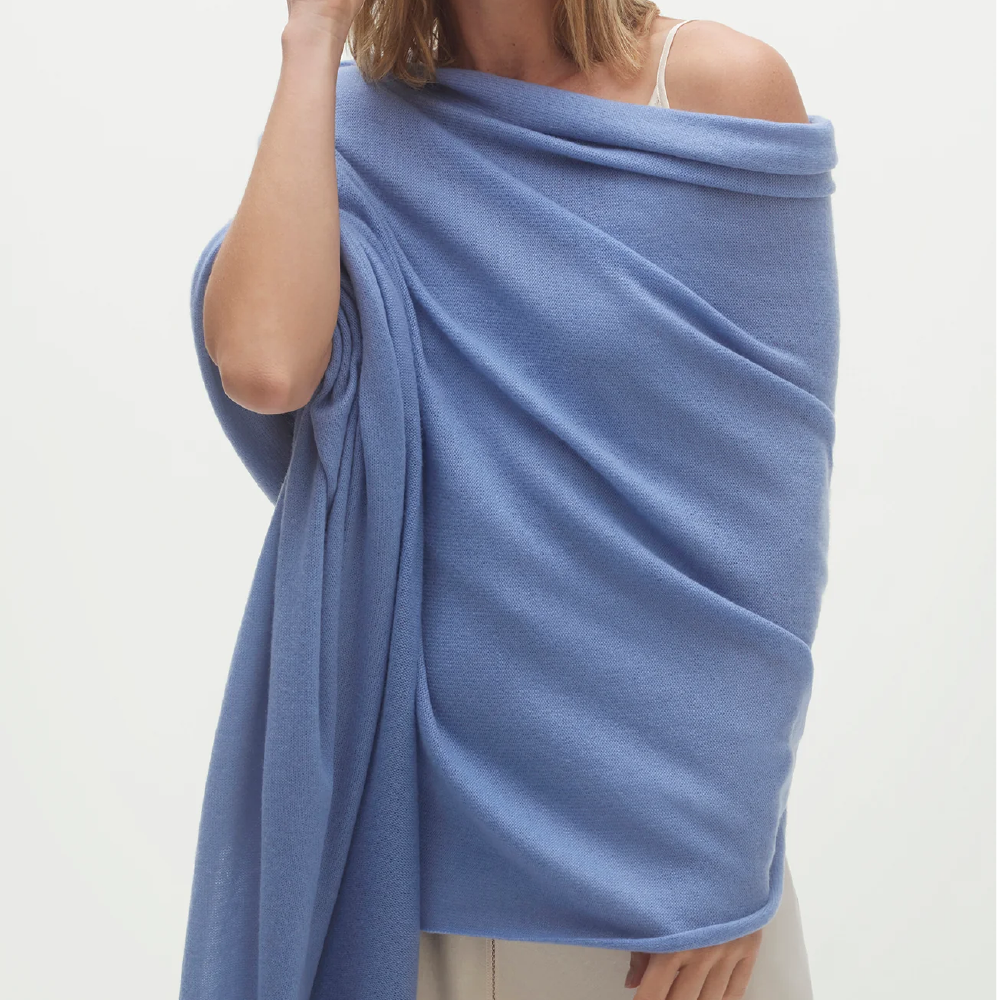 <p><strong>$215.00</strong></p><p><a href="https://go.redirectingat.com?id=74968X1553576&url=https%3A%2F%2Fwww.nakedcashmere.com%2Fproducts%2Fkarlie-shawl&sref=https%3A%2F%2Fwww.cosmopolitan.com%2Fstyle-beauty%2Ffashion%2Fg46871736%2Fbest-travel-wraps%2F">Shop Now</a></p><p>When you buy from Naked Cashmere, you know you're getting quality. Every piece that I have ever worn from the brand is made with the softest cashmere and truly lasts the test of time. I love this travel wrap because it's super large in size, yet still feels incredibly lightweight. It's available in classic black, white, and navy, but if you're looking for a lil pop of color, consider the light blue or peach colors.</p><ul><li><strong>Material:</strong> 100% cashmere</li><li><strong>Colors: </strong>5</li></ul>