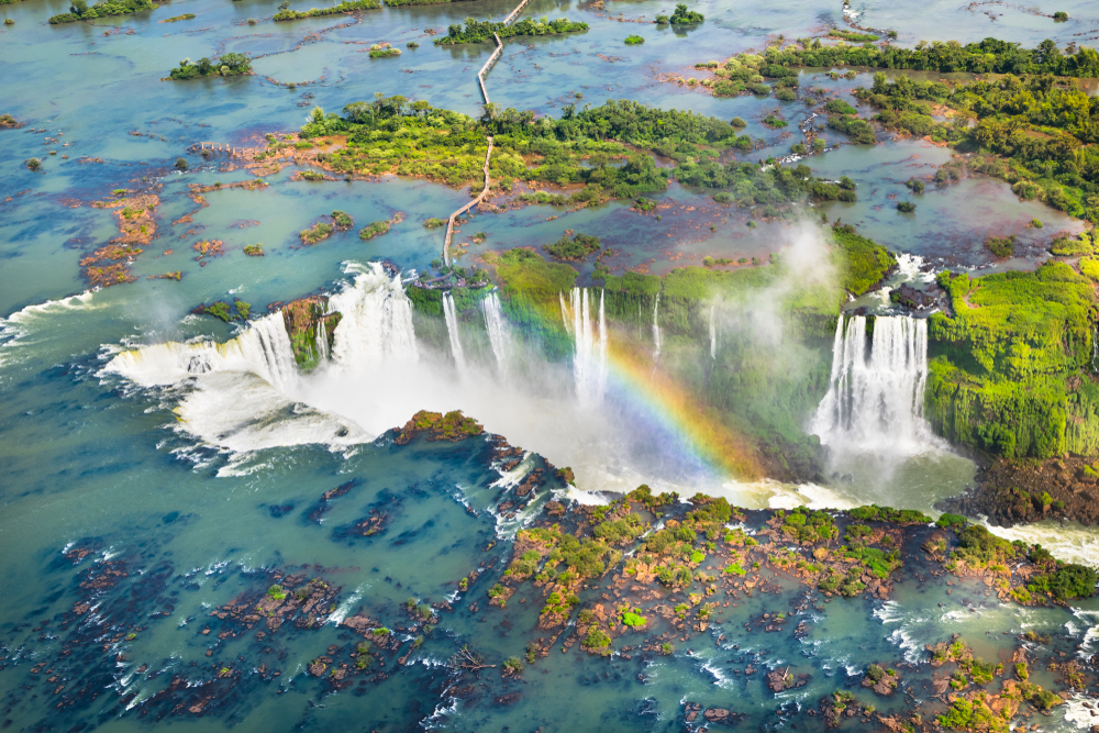 <p>Iguazu Falls is a waterfall complex on the Iguazu River, comprised of 275 waterfalls of varying sizes. One of the largest is the 269-foot-high, horseshoe-shaped “Devil’s Throat”.</p>