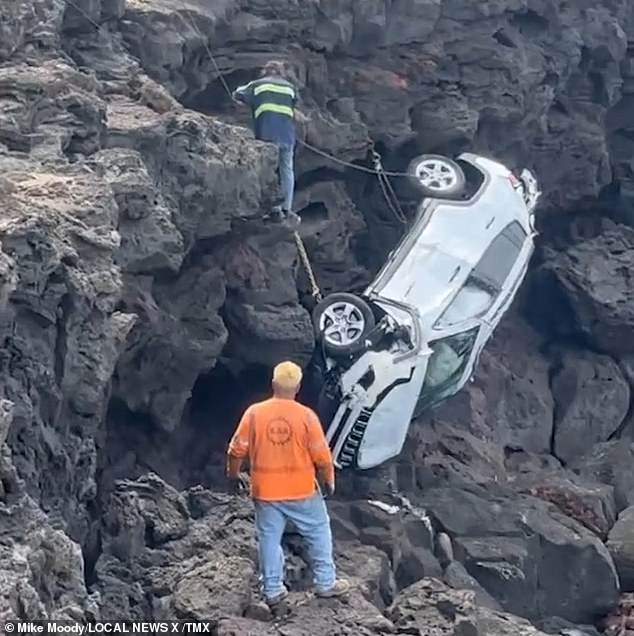 tourist, 27, accidentally drives his jeep off a 60ft cliff after taking a wrong turn while off-roading in hawaii - but somehow survives despite falling from wreckage and being swept out to sea