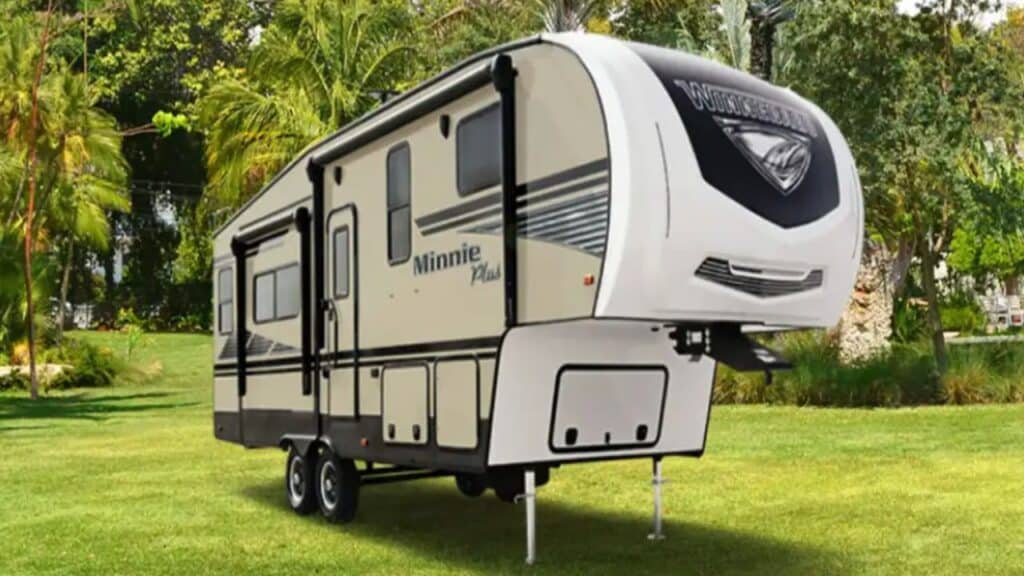 <p>The 25RKS floor plan of the Winnebago Micro Minnie Plus features a rear kitchen design. Rear kitchen designs are always nice for reducing kitchen traffic because people won’t be walking through the kitchen when they are moving between the bedroom, bathroom, and living room areas. </p><p>One thing I love about the Winnebago brand is that they stand behind their small 5th wheel trailers with a three-year warranty. This is an extended warranty when compared to what many other manufacturers offer. </p><p>Some of the best interior features in the Micro Minnie Plus include: </p><ul> <li>Full Galley with <a href="https://thewaywardhome.com/12-volt-refrigerator" rel="noopener"><strong>Fridge</strong></a>, 3-Burner Cooktop, Microwave, and Stainless Steel Sink</li> <li>Bathroom with Shower, Foot-Pedal Flush Toilet, and Stainless Steel Sink</li> <li>Bedroom with a Queen bed and Optional TV Installation</li> <li>Roof Air Conditioning</li> <li>10-Gallon Water Heater</li> </ul>