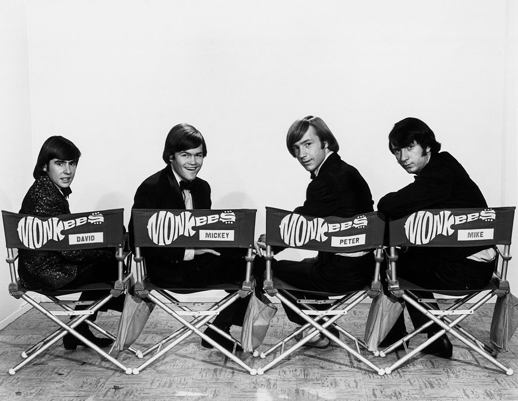 <p>It was the massive success of The Beatles that actually inspired a TV producer to think up a TV show about the misadventures of a band. The four actors on <i>The Monkees</i> were hired for their acting skills and their singing, and it didn't take long for them to learn how to perform live and transform into the band they played on TV. </p> <p>In two seasons the show—and technically the band—had six number one hits. It marked the first time we saw a boy band orchestrated. </p>