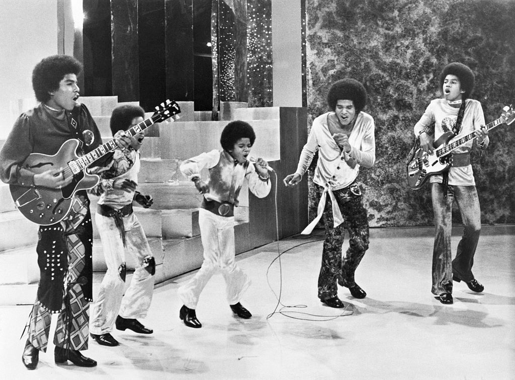<p>Family boy bands are a dime a dozen today, but The Jackson 5 were the first to do it. Tito, Jermaine, Jackie, Marlon, and of course, Michael made up the iconic R&B group. The five of them had been performing together for years before actually being signed.</p> <p>The Jackson 5 were the first to do some seriously iconic things like perform with close harmonies, insert catchy pop music hooks, and use choreographed dance moves. </p>