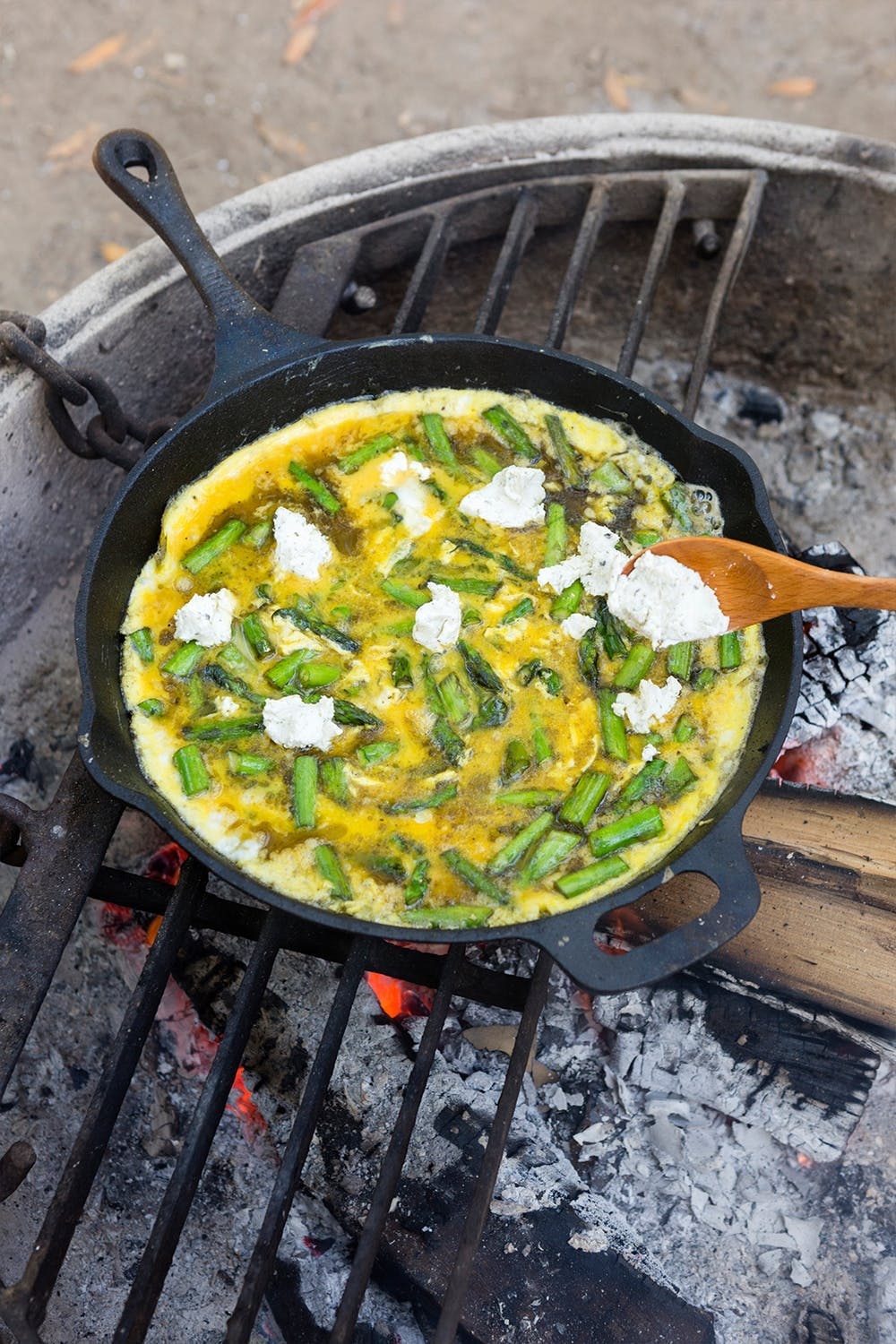 You can’t go wrong with a frittata, even when you're pressed for time. This recipe is so quick to whip up, you can have this dish ready before anyone says they’re hungry. Grill it over a fire pit, or simply cook it over your stovetop. (via Brit + Co.)