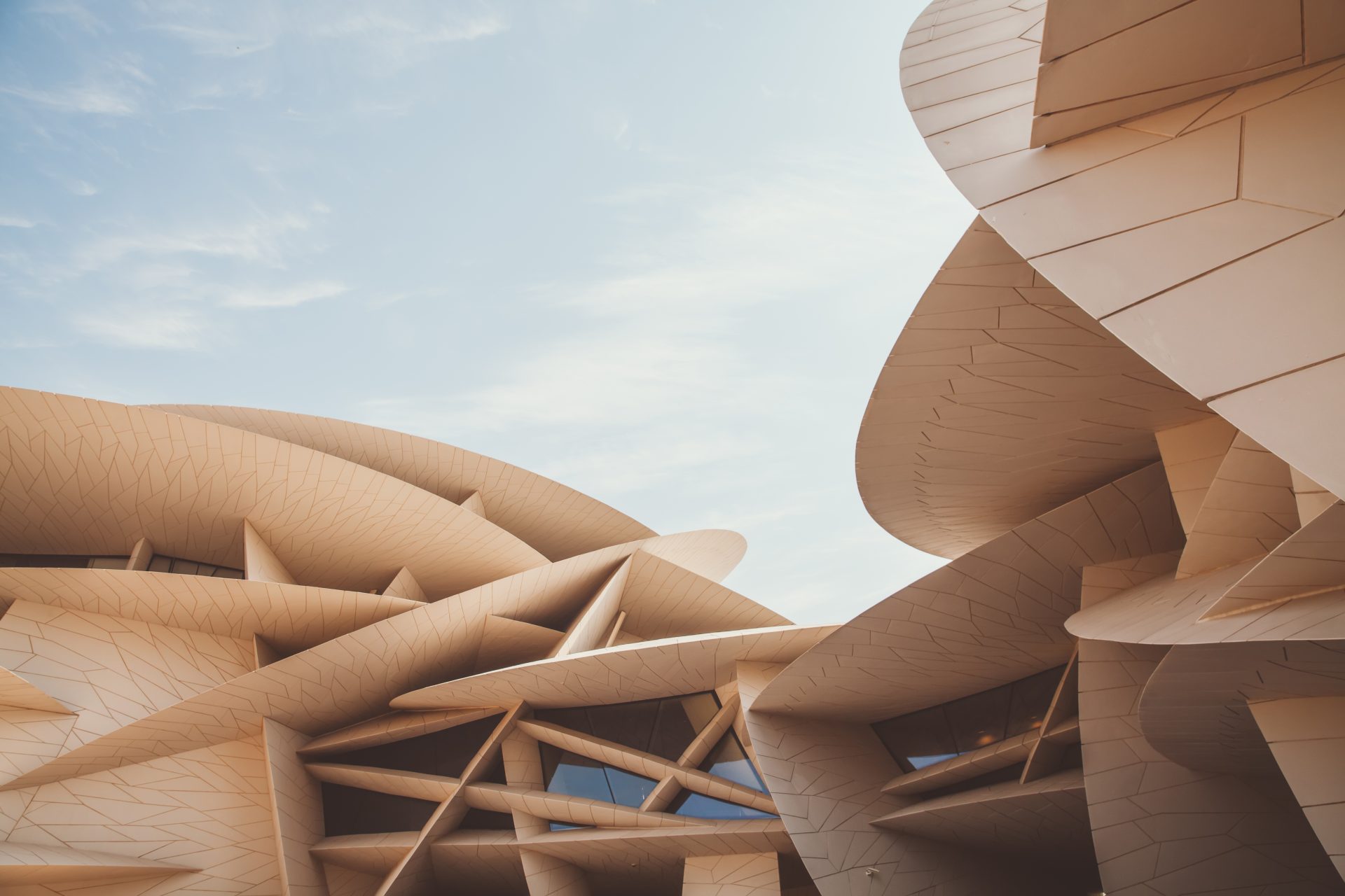 <p>In Qatar, there's a breathtaking National Museum worth visiting. It's clean, formed by elegant lines that evoke the simplicity and harmony of nature's “desert roses”. The mix of modern and traditional elements could reflect the dynamic relationship between human progress and the natural environment.</p>