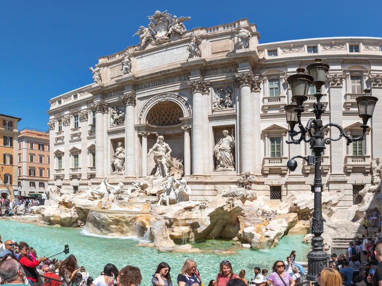 Rome is home to several popular tourist attractions, like the Trevi Fountain. Andrew Linscott/Shutterstock