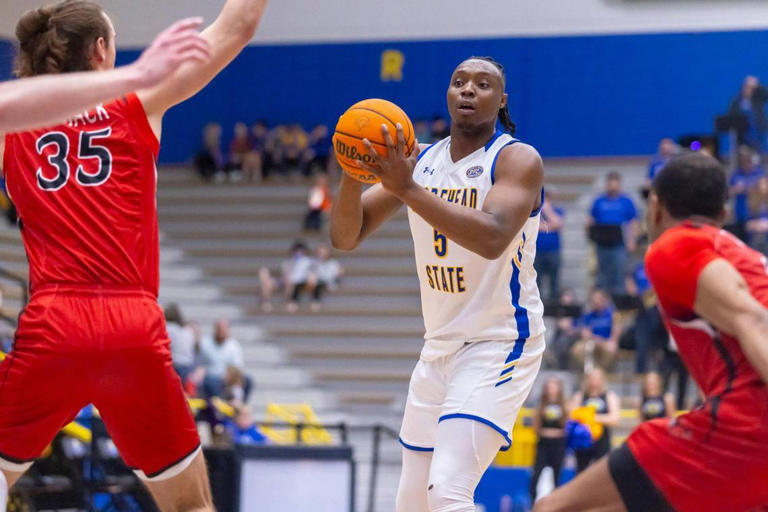 Morehead State Eagles forward Zach Iyeyemi (5) looks to pass the ball during a game against the Southeast Missouri State Redhawks at Johnson Arena in Morehead on Feb. 29.