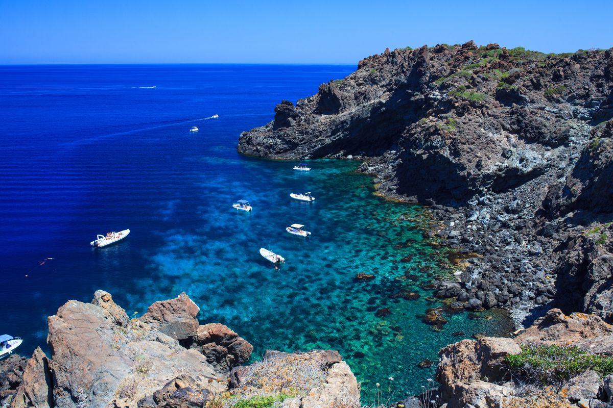 <p>Made famous by the film <em>A Bigger Splash</em> back in 2015, Pantelleria was until then one of Italy’s best-kept secrets. The island is in the Strait of <a href="https://www.harpersbazaar.com/uk/travel/g43551184/sicily-hotels">Sicily</a>, and fewer than 70 kilometres from the coast of Tunisia. As with many of Italy’s isles, it’s volcanic, with lava rock formations, beautiful bays, an ancient castle, lots of old churches, narrow cobbled streets to stroll and vibrant markets to browse. It’s home to several lakes, including the heart-shaped Specchio di Venere, along with acclaimed wineries and orchards producing prized olives, dates and capers.</p><p><strong>Where to stay: </strong><a href="https://www.mrandmrssmith.com/luxury-hotels/sikelia-luxury-retreat">Sikelia Luxury Retreat</a> is a boutique retreat that can be hired as a whole to create a private island paradise for you and a select fortunate few.</p>