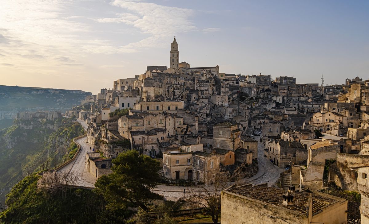 <p>The main attraction in millennia-old Matera in the south is its Unesco-protected Sassi, a complex of cave dwellings carved into the edge of a mountain, inhabited since the Paleolithic period until as recently as the early 1950s. It’s thought to be one of the oldest cities in the world, up there with the likes of Jericho and Aleppo. Unsurprising for somewhere this photogenic, it’s no stranger to film crews – James Bond fans will have spied it in No Time To Die. The city – in the Basilicata region, which borders Puglia and Calabria – is built on a rocky outcrop with a canyon backdrop. More history awaits at its rock churches, some of which are graced by 13th-century frescoes.</p><p><strong>Where to stay:</strong> If you want to experience what it might have been like for the cave dwellers of Matera, stay at the atmospheric <a href="https://www.mrandmrssmith.com/luxury-hotels/sextantio-le-grotte-della-civita">Sextantio Le Grotte Della Civita</a>. Or be a temporary member of the Coppola clan with a sojourn to their Italian <em>casa</em>, <a href="https://www.mrandmrssmith.com/luxury-hotels/palazzo-margherita">Palazzo Margherita</a>, in the walled 15th-century town of Bernalda.</p>
