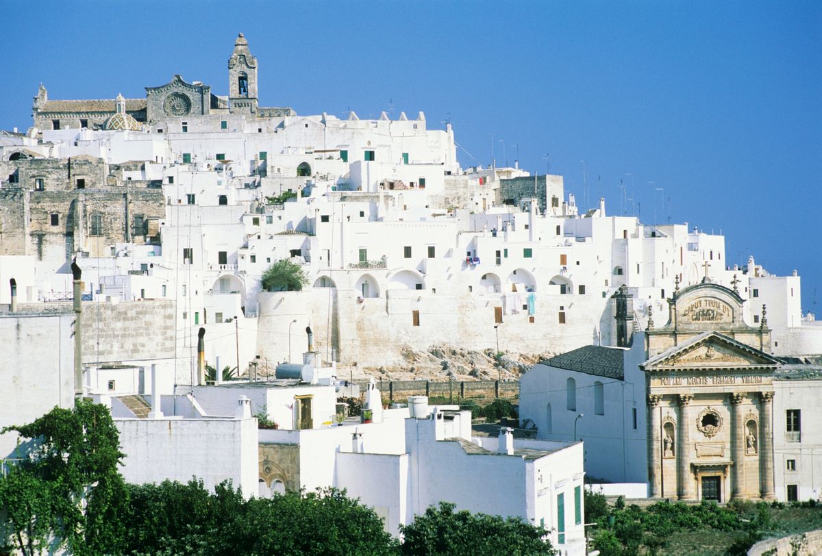 <p>Dazzling Ostuni is all the way down south in the heel of Italy’s signature knee-high boot, with bright white buildings, and lots of scenic surrounding countryside and shorelines. The whitewashed old town is complemented by a cathedral with Gothic, Romanesque and Byzantine architectural accents, and the Porta San Demetrio, one of the city’s original mediaeval gates. While you’re here, Puglia has many more places that are worthy of a visit, including the Baroque beauty Lecce, affectionately known as the Florence of the South, sleepy seaside towns such as Castro and Gallipoli, and gourmet haven Nardò, flocked to by foodies in the know.</p><p><strong>Where to stay:</strong> <a href="https://www.mrandmrssmith.com/luxury-hotels/paragon-700">Paragon 700</a> is a boutique hotel housed within a palazzo in Ostuni, with a vaulted restaurant and a swimming pool you’ll be grateful for when the scorching summer heat hits.</p>