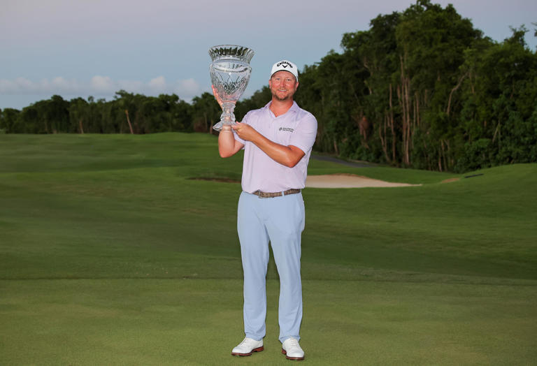 Brice Garnett celebrates with the trophy after winning the 2024 Puerto Rico Open at Grand Reserve Golf Club in Rio Grande, Puerto Rico. (Photo: Jonathan Bachman/Getty Images)
