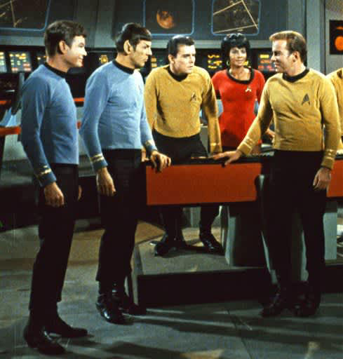 DeForest Kelley, left, Leonard Nimoy, second left, Nichelle Nichols, second right and William Shatner, right, appear in a scene from the TV series 