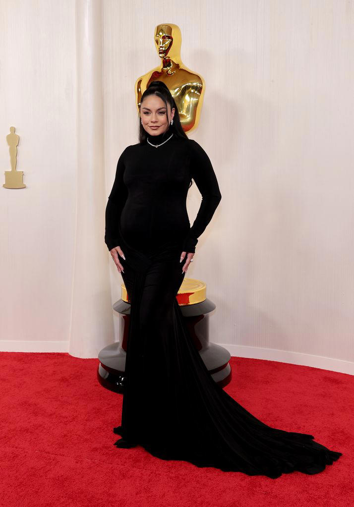 Glowing Vanessa Hudgens debuts baby bump at Oscars first photos