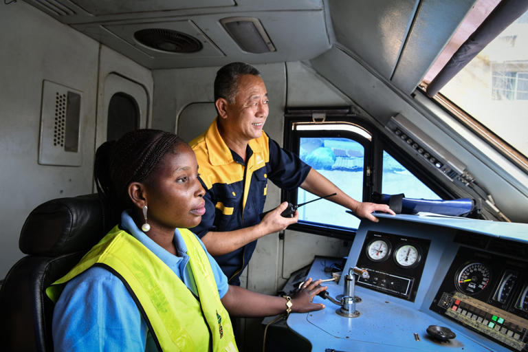 Part of the reason for the decline in the number of Chinese workers in Africa could be due to training such as this, where Chinese train driver Wei Rujun instructs driver Serah Abiara in Lagos, Nigeria. Photo: Xinhua