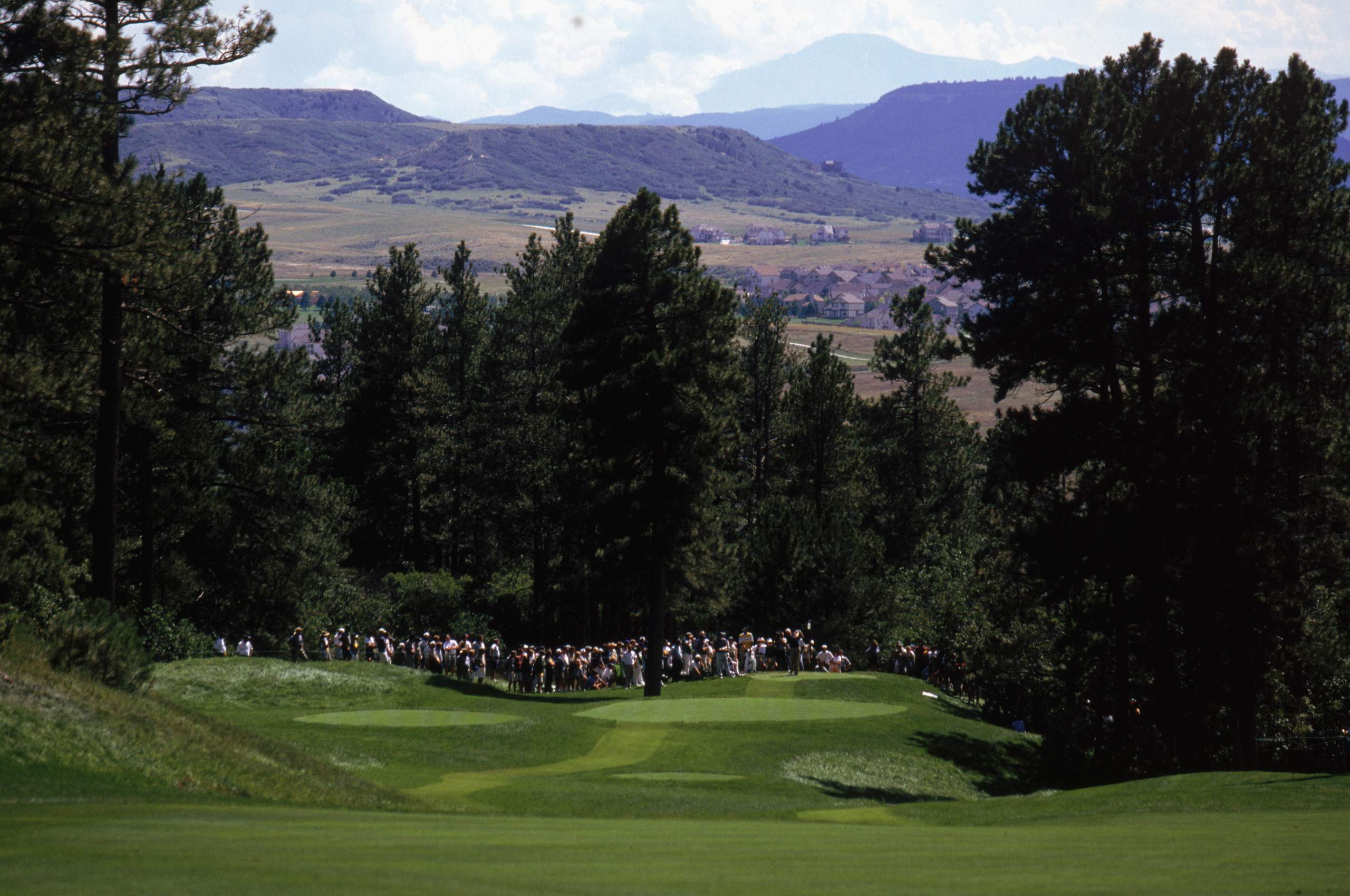 <em><b>Course Location: Castle Rock, Colorado</b></em> In 1969, Jack Vickers embarked on a journey to familiarize himself with Denver's landscape, leading him to discover the breathtaking property that would later become Castle Pines Golf Club. After stumbling upon a dirt lane and ascending a rocky ridge, he was captivated by the panoramic views of Colorado's natural beauty, envisioning it as the ideal location for his envisioned world-class golf course. After 12 years of negotiating, Vickers struck a deal with local landowners to secure the acreage needed for his dream project. With the site established, Vickers enlisted Jack Nicklaus as the course designer, despite their occasional disagreements, resulting in the creation of one of the nation's premier golfing destinations. Construction commenced in 1979, culminating in the grand opening of Castle Pines Golf Club in October 1981.