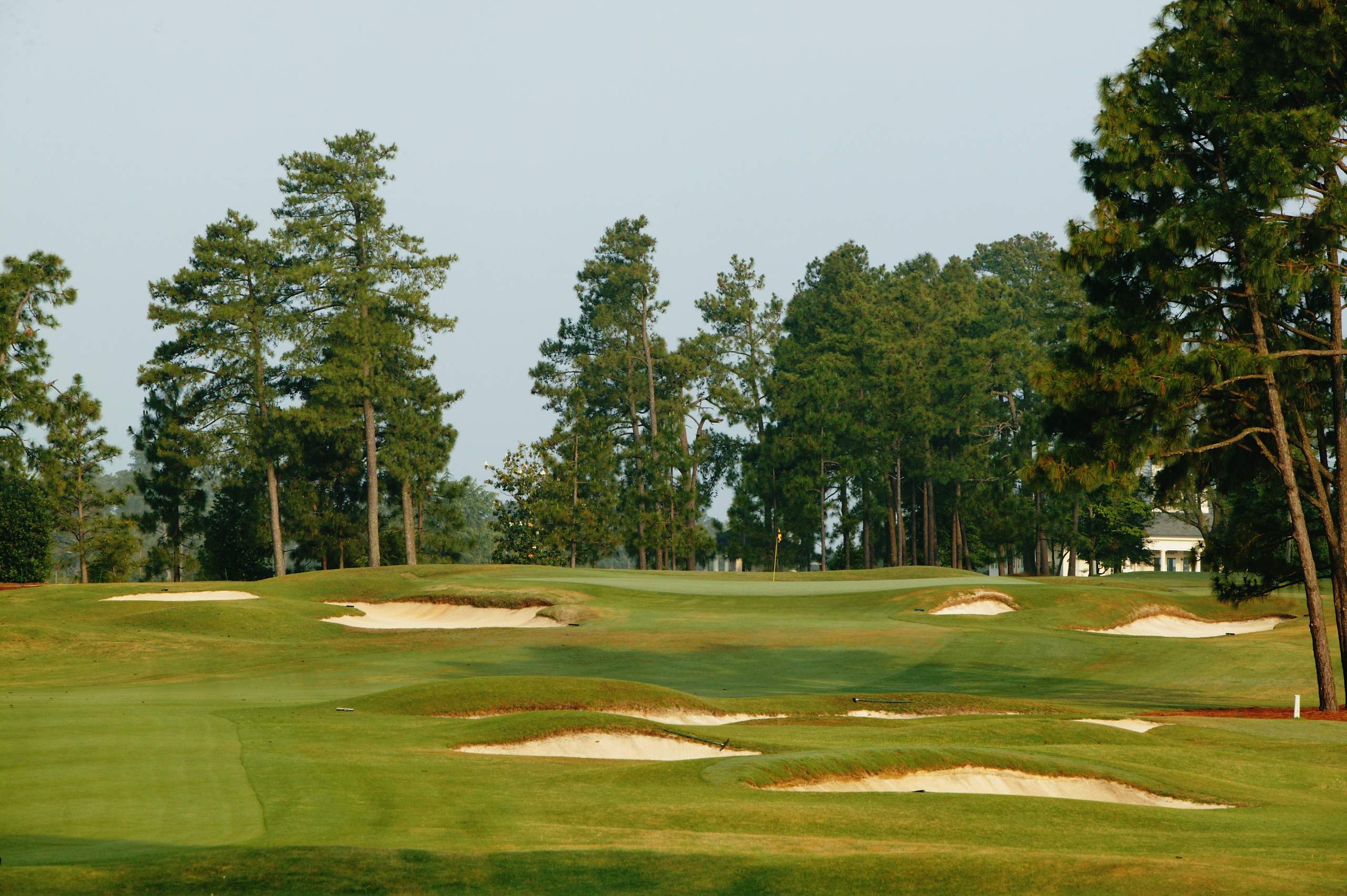 <em><b>Course Location: Pinehurst, North Carolina </b></em> The Pinehurst Resort in North Carolina is home to NINE 18-hole courses. Talk about a grand property. In 1907, Donald Ross' design was completed. This included introducing Pinehurst's second course to the state. No. 2 is known for having incredibly tough greens. At one time, the course was also lined with a thick Bermuda rough. However, Bill Coore and Ben Crenshaw removed all of the rough during their renovation and returned the course to its original form. The course has hosted four Majors -- most recently the 2014 U.S. Open -- and is currently scheduled to host five more Opens between 2024-2047.