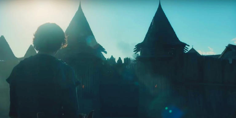 A Child staring at two castle turrets in The Last Kingdom