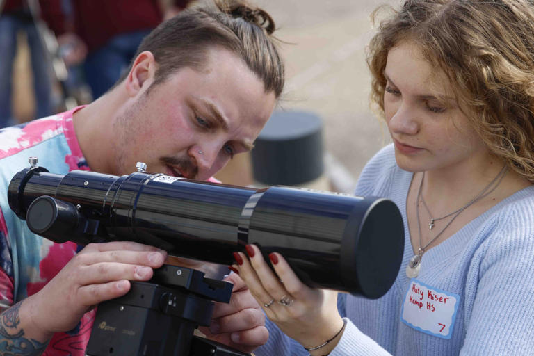 Billy House and Katy Kiser of Kemp High School, set up a telescope during a training session that members of the North Texas CATE team will be setting up to study the sun during the April 8 total solar eclipse, photographed here on Feb. 3, 2024, at Frontiers of Flight Museum in Dallas.