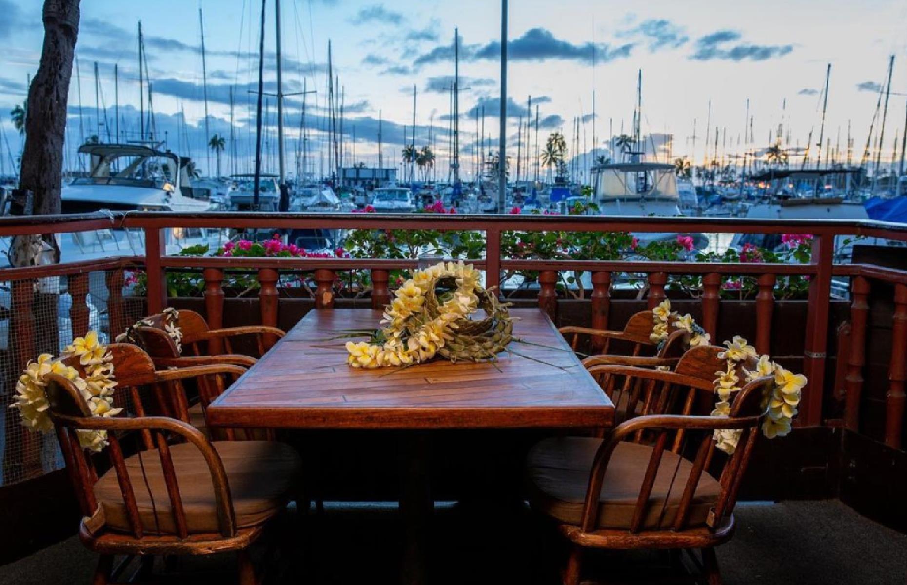 <p>It’s the setting that really elevates this popular date-night (or any special occasion) spot. The most coveted tables at Chart House Waikiki are on the balcony overlooking Ala Wai Boat Harbor, which looks especially lovely as the sunset casts a pink and golden glow. Beautiful blooms and rustic wooden furniture add to the charm of the restaurant, which is known for its succulent seafood platters, juicy steaks, and generous wedges of chocolate mud pie. </p>