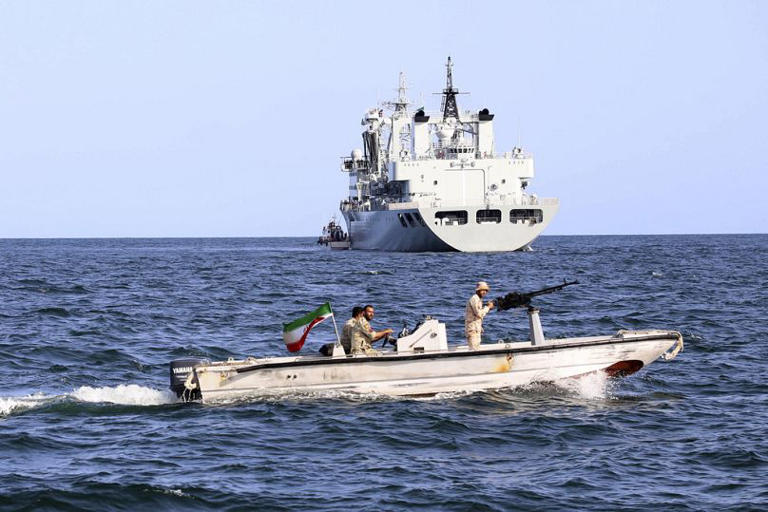 An Iranian military boat patrols as a warship enters the Iranian waters prior to start of a joint naval drill of Iran, Russia and China in the Indian Ocean. AP/AP