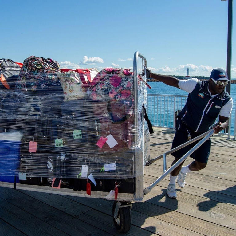 Shepler's Ferry service, which carries an estimated 650,000 visitors to Mackinac Island annually, wants to use technology to track luggage on and off the boats. This image shows one of the many Shepler's workers hauling luggage carts between April and October.