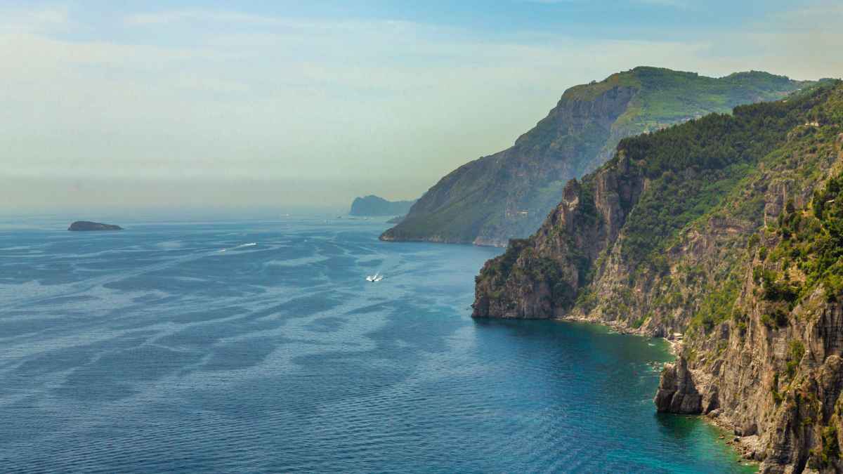 <p>Italy’s Amalfi Coast is a 31-mile stretch with views of high cliffs and the bright sea. You’ll see villages painted in soft colors, terraced vineyards climbing the slopes, and fragrant lemon groves. This road offers a perfect fusion of stunning scenery and charming seaside towns for an amazing drive.</p>