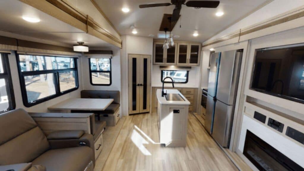 <p>The Flagstaff Classic was a light RV, but the Super Lite outpaces it, giving you another excellent choice if your truck can’t tow some of the heavier models on our list. But in spite of its smaller dimensions and lighter weight, it’s the perfect RV if you like to entertain guests.</p><p>Inside, there’s bar-top seating at a mini bar that’s complete with a wine refrigerator. For those that can’t find room at the bar, there’s a luxurious hide-a-bed sofa across from the RV’s electric fireplace and LED TV. Plus, there’s an upgraded speaker system and subwoofer when you want to crank the tunes.</p><p>Outside, a power awning with an LED light strip provides sun protection by day and ambiance by night. There are also outdoor speakers, an outdoor griddle with an LP quick-connect, and extended 76″ entry doors so you don’t knock your head when going back and forth from the inside of your RV to your outdoor camping area.</p>