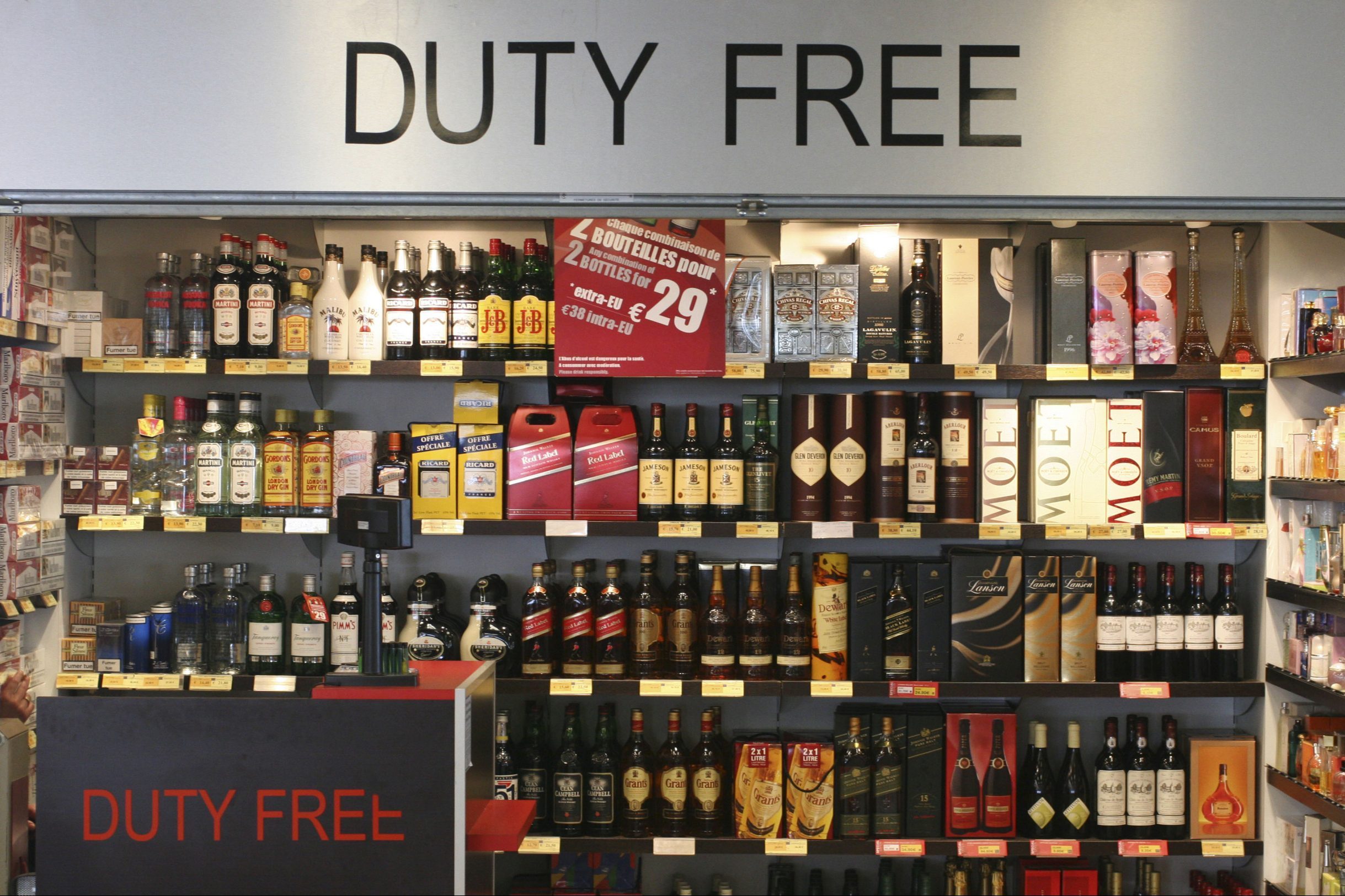 <p>If you've ever flown internationally (or passed through an international terminal), you've likely seen the brightly-lit consumer paradise of a duty-free shop.</p> <p>But what is a duty-free shop? These are stores that sell all kinds of products for which a "duty" (a local import tax or fee placed on goods by government entities) is not included. Normally, buying products in a duty-free shop allows travelers to save money on liquor, tobacco, fragrances, cosmetics, luxury items, candy, and more.</p> <p>Note: When traveling internationally and shopping duty-free (a great <a href="https://www.rd.com/list/airport-layover/">thing to do on your airport layover</a>), the cashier at the register is going to ask to see your boarding pass to verify travel out of the country. Travelers leaving the United States for at least 48 hours may shop duty-free.</p>