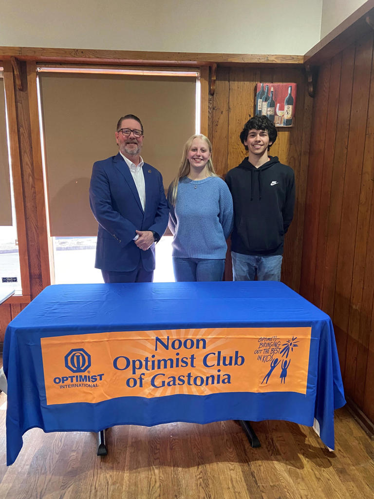 Jay B Smith with the Noon Optimist Club is pictured with contest winners Laura Haskins and Noah Sanders.