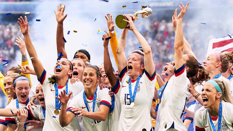 USA lifting the FIFA Women's World Cup trophy in 2019.