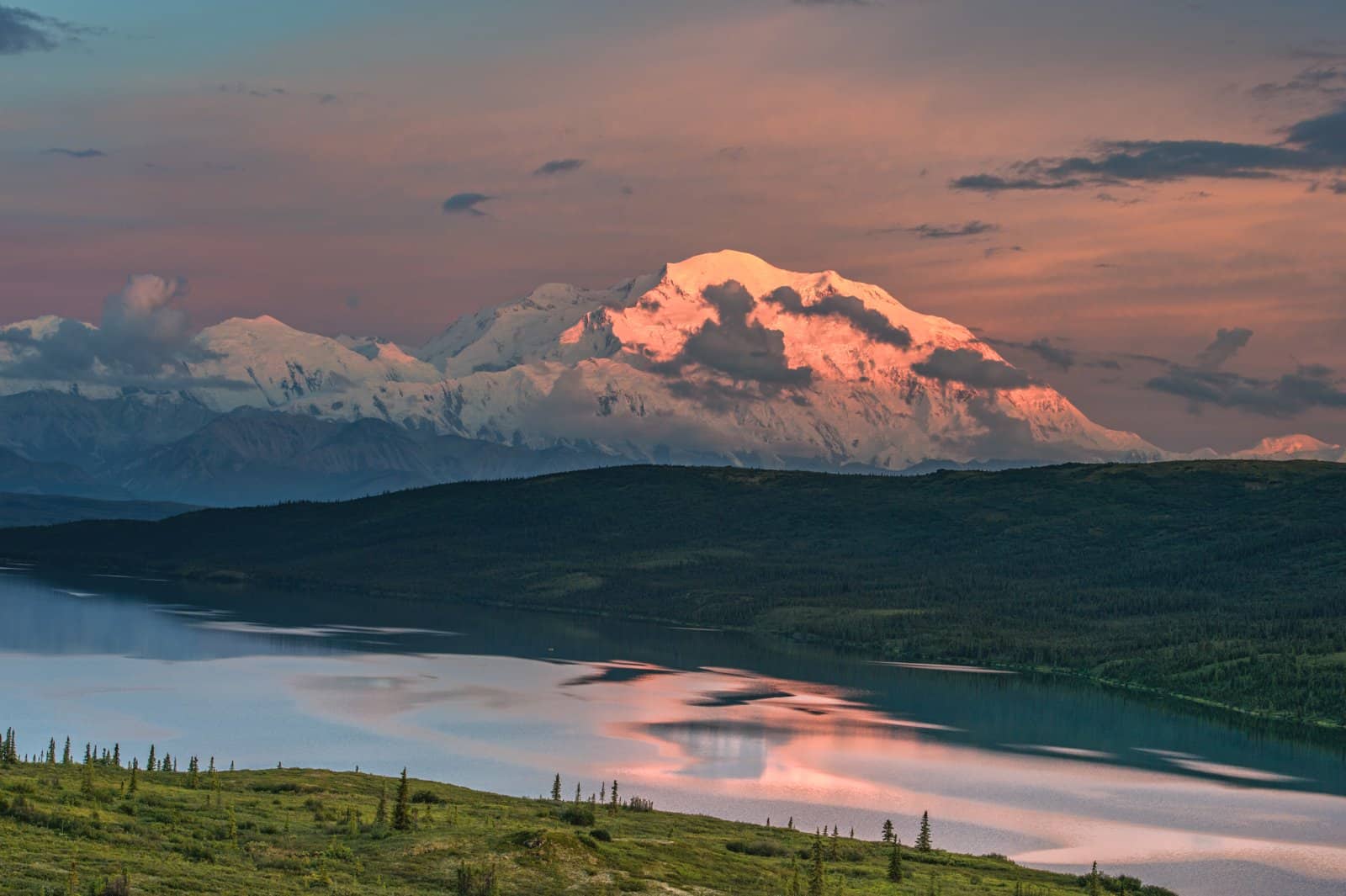 <p><span>As evening approached, I made my way to the shores of Wonder Lake, known for its mirror-like reflections of Denali on clear days. The setting sun painted the sky with hues of pink and orange. It casts a magical glow over the iconic peak. The tranquility of the lake and the silhouette of Denali created a surreal and unforgettable moment.</span></p> <p><span>The experience was a fitting end to a day filled with exploration, adventure, and a deep connection to the untamed beauty of Denali National Park.</span></p>