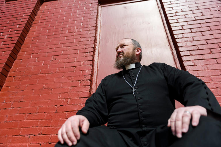 James Neal is known for his embrace of Enid’s LGBTQ community. He calls himself “the weird priest in the dress shouting into the storm.” (Michael Noble Jr. for NBC News)
