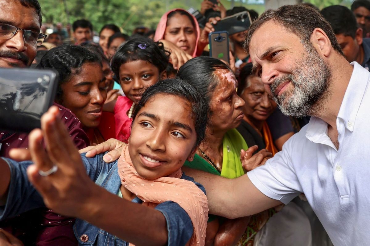 Congress leader Rahul Gandhi poses for a selfie during a programme in Wayanad. (Image: PTI/File)