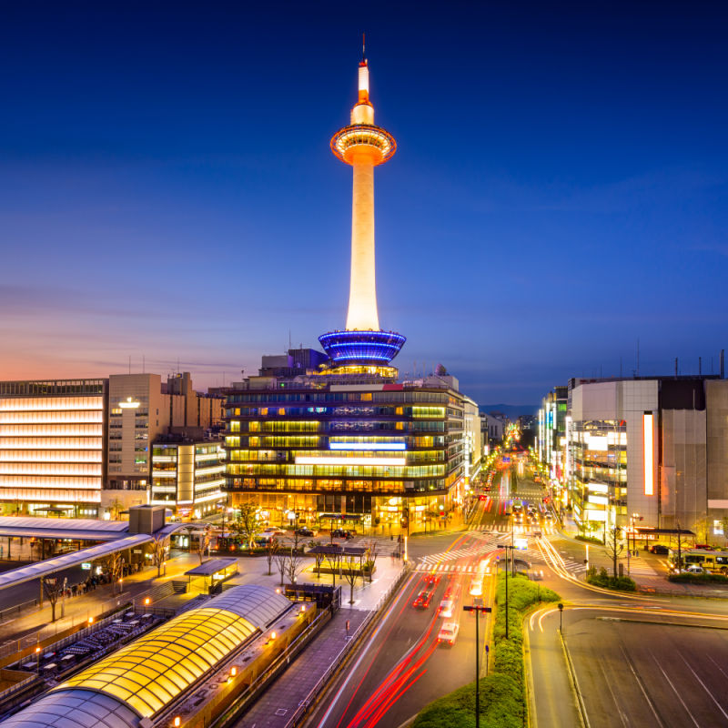 night view of kyoto city with light trails and famous kyoto tower in the background